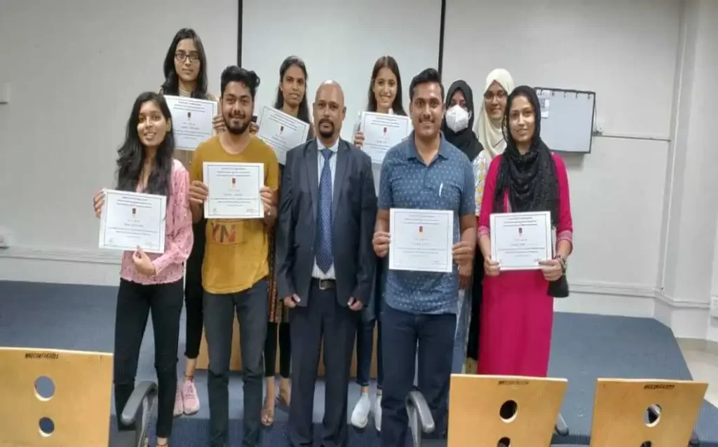 Students holding interview course certificate after availing services of job interview coaching in Pune India